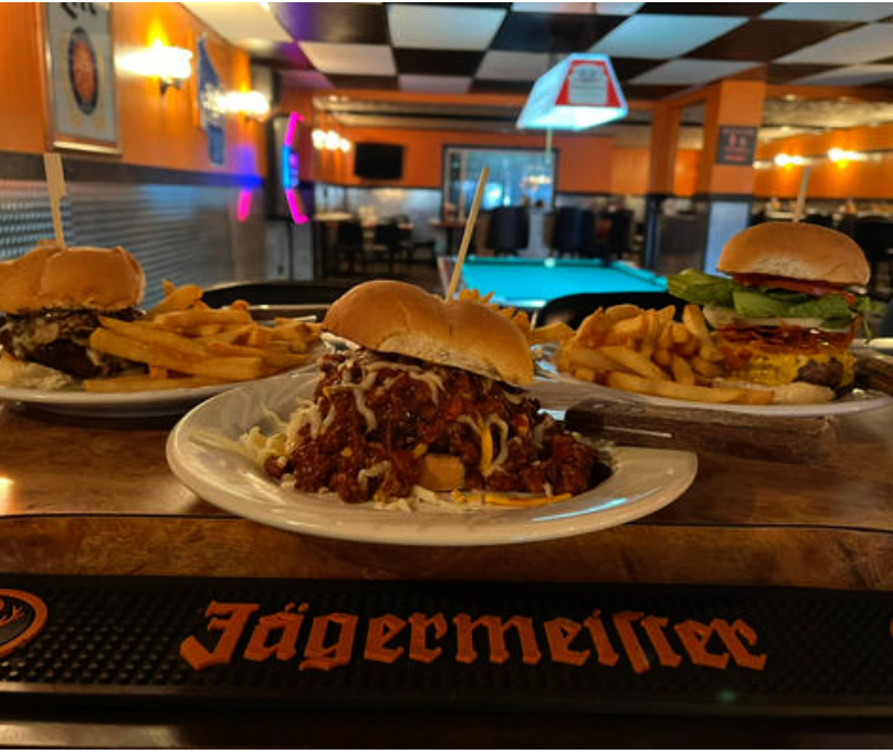The bar spread — burgers, chili & a Jäger mat